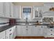 Kitchen with custom white cabinets, dark countertops, and stainless steel appliances at 4737 Uzzle Rd, Rougemont, NC 27572