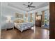 Spacious main bedroom with tray ceilings, hardwood floors, and access to a private balcony at 4737 Uzzle Rd, Rougemont, NC 27572