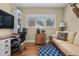 Bright office space with large windows, built-in bookshelves, and hardwood floors at 4737 Uzzle Rd, Rougemont, NC 27572