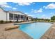 Beautiful in-ground pool with a stone diving rock, patio, and view of the backyard at 4737 Uzzle Rd, Rougemont, NC 27572