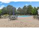 Pool patio features outdoor seating, dining, and mature trees at 4737 Uzzle Rd, Rougemont, NC 27572