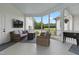 Relaxing screened-in porch with outdoor seating, a TV, and a view of the backyard at 4737 Uzzle Rd, Rougemont, NC 27572