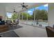 Inviting screened-in porch featuring wicker furniture with a view of the sparkling pool and backyard at 4737 Uzzle Rd, Rougemont, NC 27572