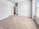 Spacious bedroom with plush carpet and large closet, providing ample storage and comfort at 477 Beacon Hill Rd # 29, Lillington, NC 27546