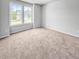 Bright, carpeted bedroom with large windows and a view, offering a cozy and inviting space at 477 Beacon Hill Rd # 29, Lillington, NC 27546
