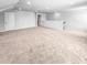 Large bonus room featuring neutral carpeting, white walls and trim, recessed lighting, and a staircase at 477 Beacon Hill Rd # 29, Lillington, NC 27546