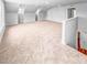 Spacious bonus room with neutral carpet, white trim, recessed lights, and a view of the staircase at 477 Beacon Hill Rd # 29, Lillington, NC 27546