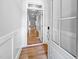 Inviting foyer with hardwood floors and white wainscoting, leading to a light-filled living space at 477 Beacon Hill Rd # 29, Lillington, NC 27546