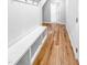 Welcoming hallway with coat rack, bench with storage, and wood-look floors at 477 Beacon Hill Rd # 29, Lillington, NC 27546