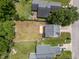 Aerial view of neighborhood with fenced backyards and mature trees at 5012 Silverdene St, Raleigh, NC 27616