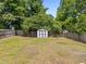Spacious backyard with storage shed and wood privacy fence at 5012 Silverdene St, Raleigh, NC 27616