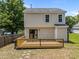 Backyard with large deck and sliding glass doors on back of house at 5012 Silverdene St, Raleigh, NC 27616
