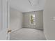 Bedroom with neutral walls, carpeting, and a window letting in natural light at 5012 Silverdene St, Raleigh, NC 27616