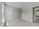 Neutral bedroom features neutral carpet, white walls, and a white door at 5012 Silverdene St, Raleigh, NC 27616