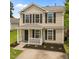 Traditional two-story home with black shutters and a well-manicured front yard at 5012 Silverdene St, Raleigh, NC 27616