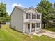 Charming two-story home with neutral siding, black shutters, inviting front porch, and neat landscaping for a welcoming curb appeal at 5012 Silverdene St, Raleigh, NC 27616