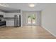Eat-in kitchen with stainless steel appliances and double doors to backyard at 5012 Silverdene St, Raleigh, NC 27616