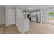 Open kitchen featuring white cabinets, stainless steel appliances and breakfast bar at 5012 Silverdene St, Raleigh, NC 27616