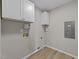 Utility room featuring modern wood flooring and neutral paint at 5012 Silverdene St, Raleigh, NC 27616