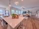 Bright open-concept living space with many windows and view to stairs, kitchen, and living room at 523 Beacon Hill Rd # 31, Lillington, NC 27546