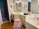 Floral-themed bathroom featuring dual vanities and ample counter space at 526 Bob Rainey Trl, Burlington, NC 27217