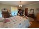 Comfortable bedroom featuring natural light, vintage furniture, and hardwood floors at 526 Bob Rainey Trl, Burlington, NC 27217