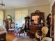 Comfortable bedroom with wood floors, gorgeous vintage furniture and decor at 526 Bob Rainey Trl, Burlington, NC 27217