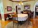 Charming dining room with hardwood floors, chandelier, and vintage furniture and decor at 526 Bob Rainey Trl, Burlington, NC 27217