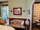 Traditional dining area featuring vintage decor and access to an adjacent powder room at 526 Bob Rainey Trl, Burlington, NC 27217