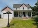 Charming two-story home with a large front porch, two-car garage and manicured lawn at 526 Bob Rainey Trl, Burlington, NC 27217