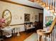 Charming foyer with decorative mirror, bench, and stairway to upper level at 526 Bob Rainey Trl, Burlington, NC 27217