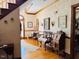 Inviting foyer featuring hardwood floors, floral wallpaper and a charming bench at 526 Bob Rainey Trl, Burlington, NC 27217