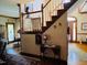 Foyer with staircase, console table with floral arrangement and carpet at 526 Bob Rainey Trl, Burlington, NC 27217