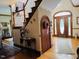 Spacious foyer with grand staircase and decorative elements at 526 Bob Rainey Trl, Burlington, NC 27217
