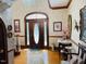 Spacious foyer with a grand entrance door, hardwood floors and chandelier at 526 Bob Rainey Trl, Burlington, NC 27217