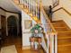 Beautiful foyer showcases wooden stairs with white balusters, leading to the upper level at 526 Bob Rainey Trl, Burlington, NC 27217