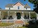 Charming two-story home with a welcoming front porch and well-maintained landscaping at 526 Bob Rainey Trl, Burlington, NC 27217