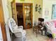 Cozy sun-drenched hallway with wicker seating, traditional decor and access to other rooms at 526 Bob Rainey Trl, Burlington, NC 27217