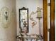 Elegant hallway with lovely decor, beautiful mirror and accent lighting at 526 Bob Rainey Trl, Burlington, NC 27217