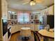 Traditional kitchen with white cabinets, modern appliances, and a cozy breakfast nook at 526 Bob Rainey Trl, Burlington, NC 27217
