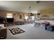 Spacious living room with carpeted floors, ample natural light, and vintage furniture at 526 Bob Rainey Trl, Burlington, NC 27217