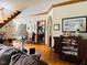 Spacious living room with hardwood floors, comfortable seating, and classic architectural details at 526 Bob Rainey Trl, Burlington, NC 27217