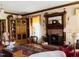 Inviting living room with brick fireplace, wood accents, and cozy seating at 526 Bob Rainey Trl, Burlington, NC 27217