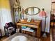 Charming living room featuring a vintage piano, decorative mirror, and classic décor at 526 Bob Rainey Trl, Burlington, NC 27217