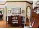 Cozy living room featuring vintage furnishings, hardwood floors, and ornate décor at 526 Bob Rainey Trl, Burlington, NC 27217