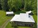 Overhead shot of farm buildings on lush green acreage at 526 Bob Rainey Trl, Burlington, NC 27217