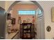 Butler's pantry featuring custom cabinets, decorative window, and open shelving for displaying cherished heirlooms at 526 Bob Rainey Trl, Burlington, NC 27217