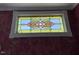 Elegant stained glass window with intricate designs and vibrant colors, adding a touch of artistry to the interior at 526 Bob Rainey Trl, Burlington, NC 27217