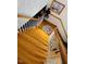 Wooden staircase with white railing, leading to the upper floor of the home at 526 Bob Rainey Trl, Burlington, NC 27217