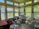 Bright sunroom featuring lots of natural light, wicker seating and tile floors at 526 Bob Rainey Trl, Burlington, NC 27217